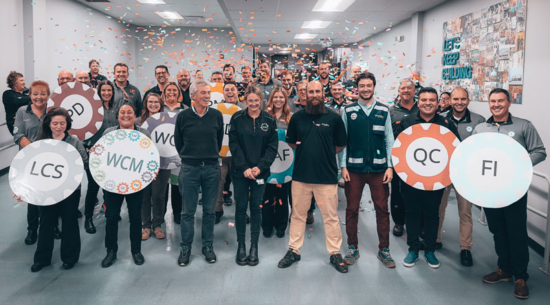 Whirlpool Corp's Findlay Operations team posing for a photo celebrating a Bronze certification for World Class Manufacturing