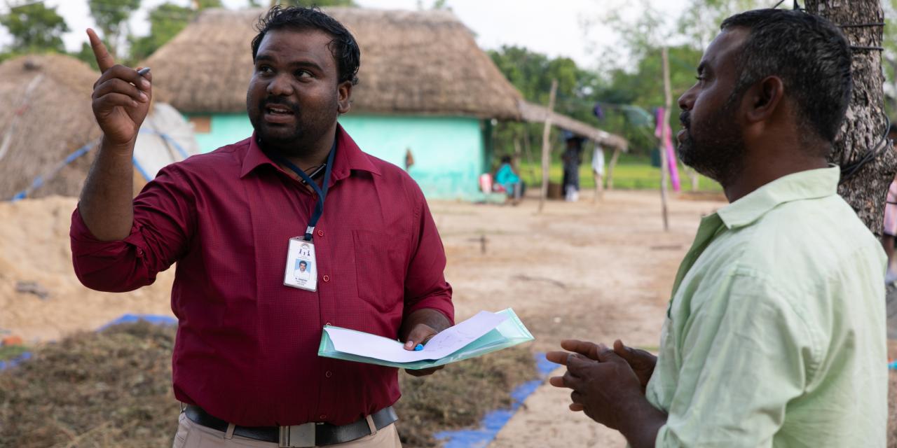 Habitat for Humanity's two men in India discussing housing innovation