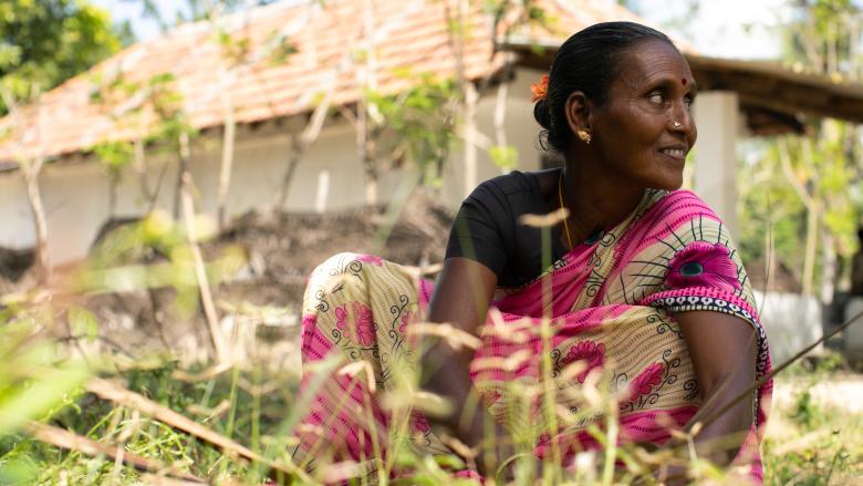 INDI-22-SL-271-02384-woman-in-garden_0 A resident of India's coastal community, benefiting from aRaksha Social Impact Trust, an innovation award winner of Habitat for Humanity's Innovation Award