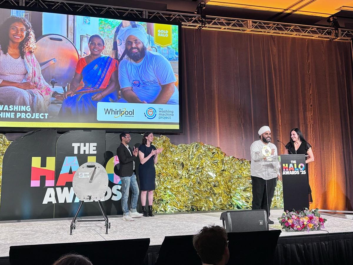 Nav and Rosa accepting gold halo award