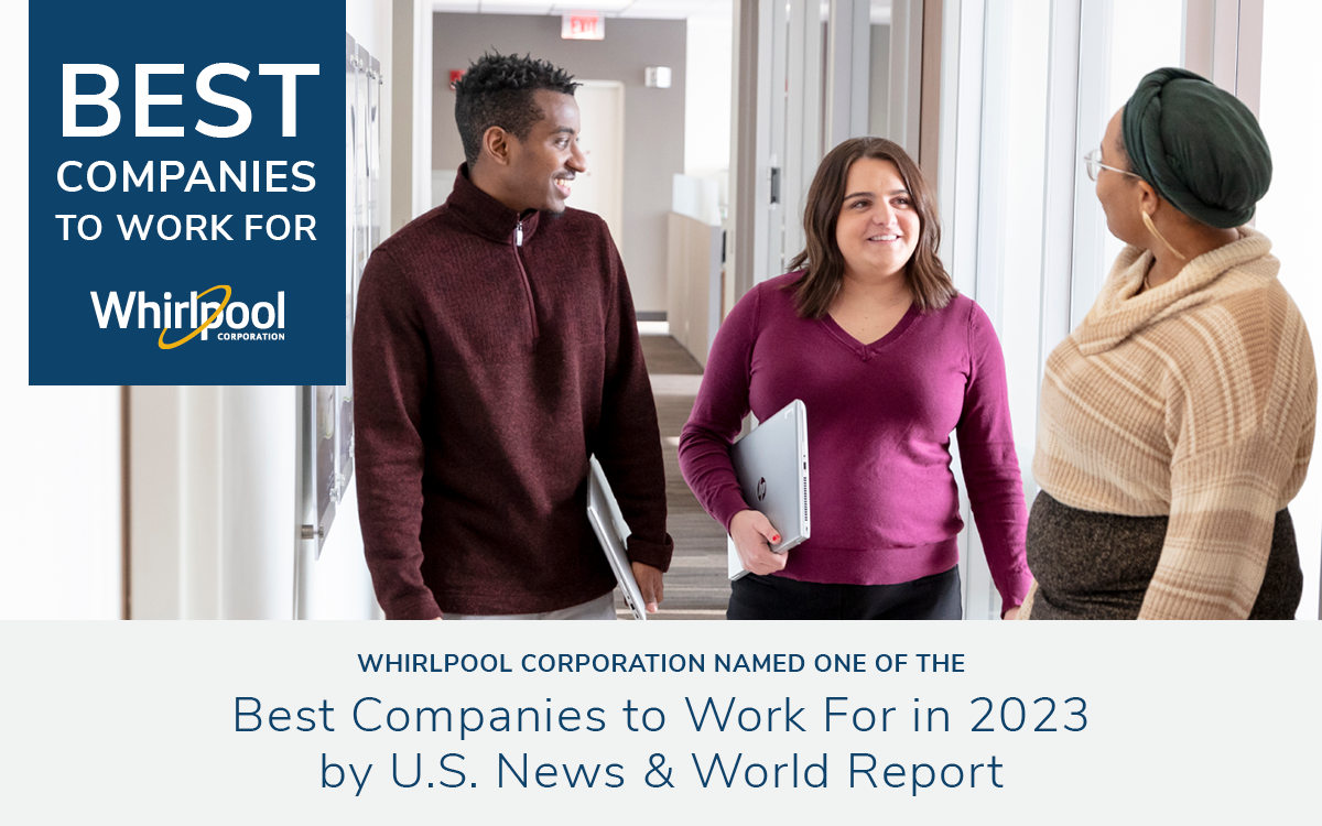 Whirlpool Employees walking down a hallway happily talking to each other