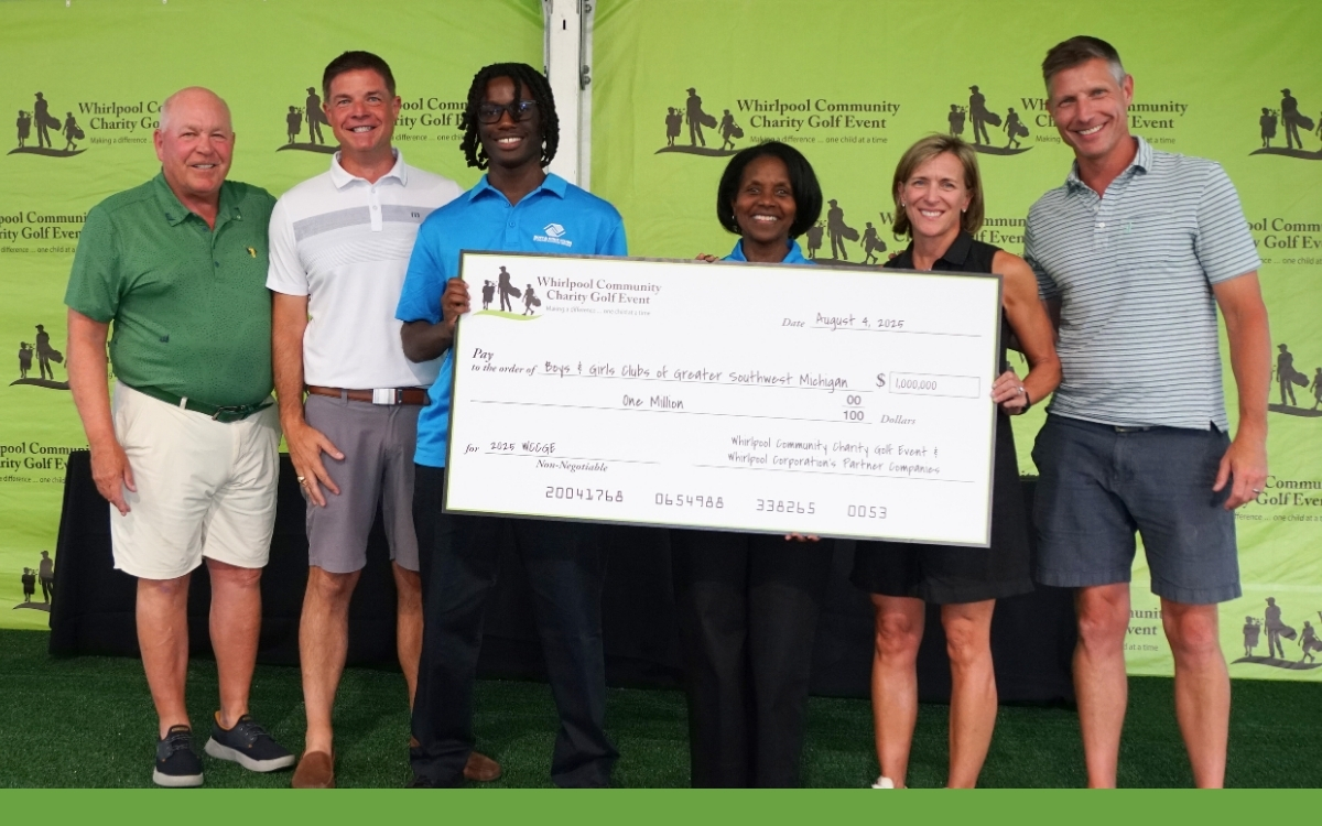 Large donation check being given to Boys and Girls Club