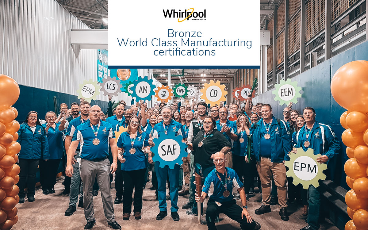 Whirlpool Clyde Operations team celebrating WCM Bronze status with bronze balloons and cheers